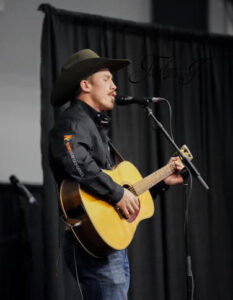Kody Lamb with a guitar